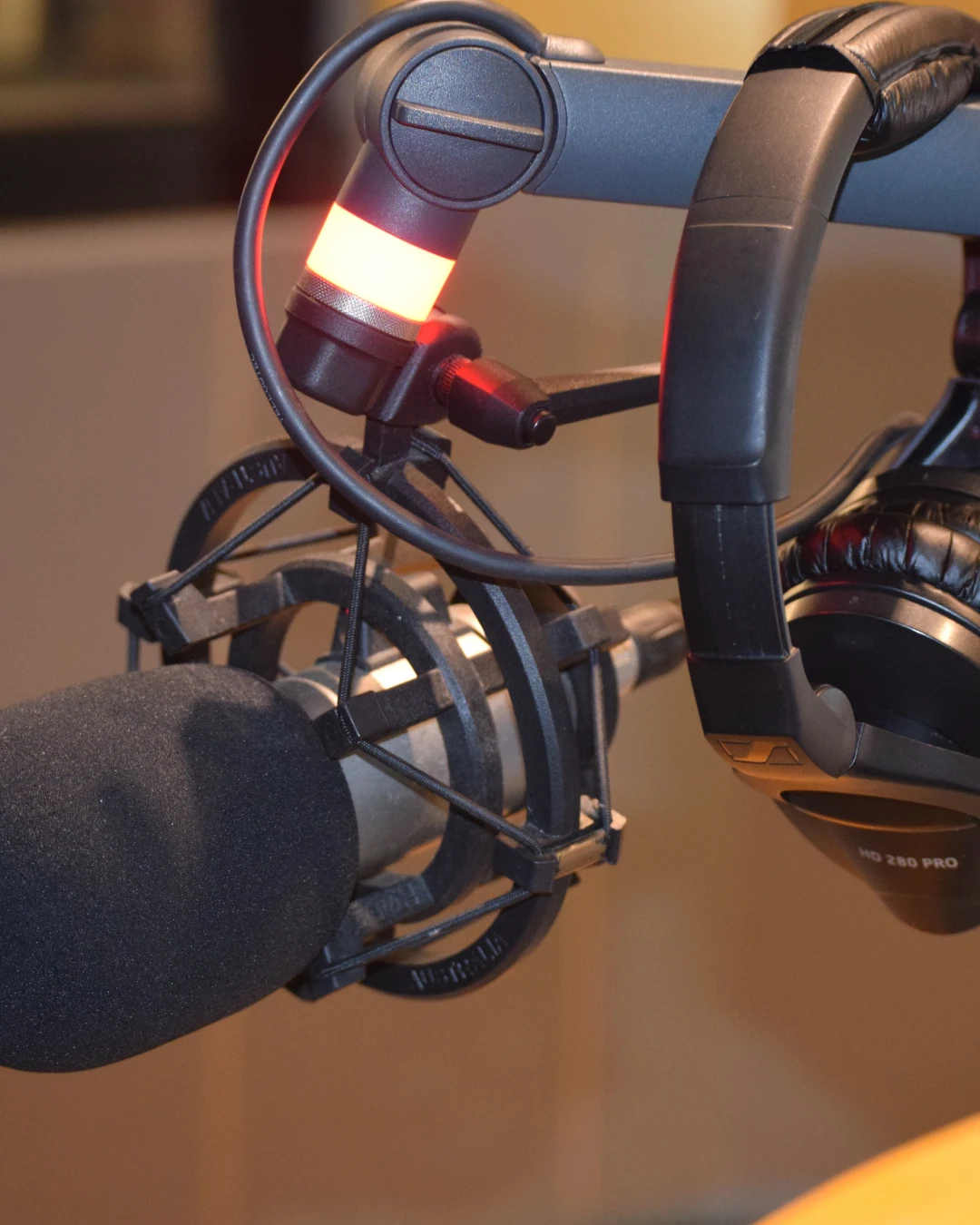A microphone and headphones ready to record a podcast